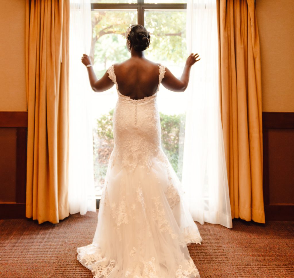 peaceful Congolese bride looking out the window