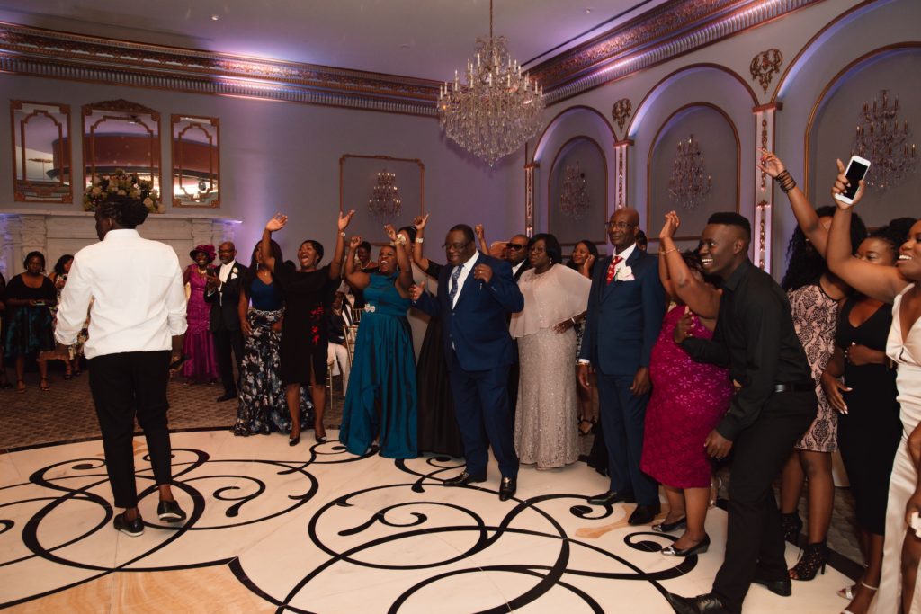 Ivoirian and Congolese multicultural wedding soul train line dance off during wedding ceremony